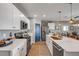 Bright kitchen features marble countertops, stainless appliances, modern white cabinets, and an island at 2943 Gibraltar Blvd, New Smyrna Beach, FL 32168