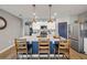 Well-lit kitchen with a large island, breakfast bar, stainless appliances, and stylish pendant lighting at 2943 Gibraltar Blvd, New Smyrna Beach, FL 32168