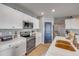 Updated kitchen boasts white marble counters, modern stainless steel appliances, and attractive lighting at 2943 Gibraltar Blvd, New Smyrna Beach, FL 32168
