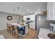 Well-lit kitchen features white cabinets, stainless steel appliances, and a large island with seating at 2943 Gibraltar Blvd, New Smyrna Beach, FL 32168