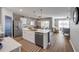 Open kitchen features a large island with quartz countertops and stainless steel appliances at 2943 Gibraltar Blvd, New Smyrna Beach, FL 32168