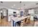 Bright kitchen with large island, breakfast bar, stylish pendant lighting and stainless steel appliances at 2943 Gibraltar Blvd, New Smyrna Beach, FL 32168