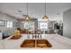 Open concept kitchen features large island with breakfast bar, a copper sink, and modern pendant lighting at 2943 Gibraltar Blvd, New Smyrna Beach, FL 32168