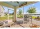 Covered patio featuring patio furniture and a lake view at 2943 Gibraltar Blvd, New Smyrna Beach, FL 32168