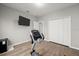 Bedroom featuring wood floors, closet, and a wall-mounted TV at 2951 Meleto Blvd, New Smyrna Beach, FL 32168