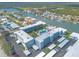 An overhead view shows the condo community that features water access, boat docks, a pool, and convenient parking at 315 N Causeway # C402, New Smyrna Beach, FL 32169