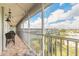 Relax on this charming balcony with brick floors and enjoy the serene views of the community and landscaping at 315 N Causeway # C402, New Smyrna Beach, FL 32169