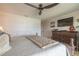 Comfortable bedroom with a large closet, dresser, and modern ceiling fan at 315 N Causeway # C402, New Smyrna Beach, FL 32169