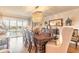 Dining room with a contemporary chandelier and access to a balcony at 315 N Causeway # C402, New Smyrna Beach, FL 32169