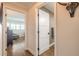 Hallway showcasing a view into the guest bedroom and updated bathroom at 315 N Causeway # C402, New Smyrna Beach, FL 32169