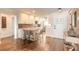 Charming kitchen featuring bar seating and white cabinets at 315 N Causeway # C402, New Smyrna Beach, FL 32169