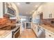 Updated kitchen with granite counters, stainless appliances, and wine fridge at 315 N Causeway # C402, New Smyrna Beach, FL 32169