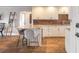 Charming kitchen featuring an island with bar stool seating and wood flooring at 315 N Causeway # C402, New Smyrna Beach, FL 32169