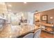 Bright kitchen with granite countertops, stainless appliances, and bar seating at 315 N Causeway # C402, New Smyrna Beach, FL 32169