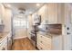 Modern kitchen with stainless steel appliances and beautiful wood backsplash at 315 N Causeway # C402, New Smyrna Beach, FL 32169