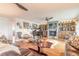 Open-concept living room with fireplace, piano, and comfortable seating area at 315 N Causeway # C402, New Smyrna Beach, FL 32169