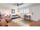 Cozy living room with a comfortable couch, desk area and stylish decor at 315 N Causeway # C402, New Smyrna Beach, FL 32169