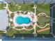 Overhead shot of the kidney-shaped pool and recreation area, with manicured landscaping and lounge chairs at 315 N Causeway # C402, New Smyrna Beach, FL 32169