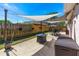 Relaxing patio area with outdoor dining and seating under stylish sunshade with decorative backyard fence at 3403 Kumquat Dr, Edgewater, FL 32141