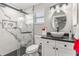 Modern bathroom features a glass-enclosed shower, elegant vanity, and contemporary fixtures at 3403 Kumquat Dr, Edgewater, FL 32141
