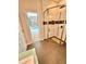 Bright bathroom featuring glass shower with bench and views to the outdoor pool area at 3435 Black Willow Trl, Deland, FL 32724
