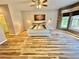 Spacious main bedroom with hardwood floors, ceiling fan and windows at 3435 Black Willow Trl, Deland, FL 32724