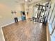 Bright bonus room features an arcade game, exercise equipment, and durable tile flooring at 3435 Black Willow Trl, Deland, FL 32724