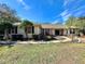 Inviting single-story home with tidy landscaping, walkway, and mature trees in a desirable setting at 3435 Black Willow Trl, Deland, FL 32724