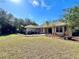 Landscaped front yard with mulched garden beds and a well-maintained lawn framing the house at 3435 Black Willow Trl, Deland, FL 32724
