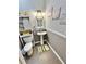 Stylish half-bathroom with decorative wall art, pedestal sink, and linen storage cabinet at 3435 Black Willow Trl, Deland, FL 32724