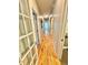 Hallway shows wood floors, neutral paint, and doors to different rooms at 3435 Black Willow Trl, Deland, FL 32724