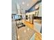 Bright kitchen featuring stainless steel appliances, granite countertops, and white cabinets at 3435 Black Willow Trl, Deland, FL 32724