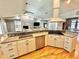 Spacious open concept kitchen with white cabinets and stainless steel appliances at 3435 Black Willow Trl, Deland, FL 32724