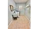 Functional laundry room featuring a utility sink, washer, dryer, and wire shelving at 3435 Black Willow Trl, Deland, FL 32724