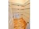 Walk-in pantry offers ample storage with wire shelving and hardwood floors at 3435 Black Willow Trl, Deland, FL 32724