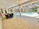 Spacious screened-in patio offers seamless transition to outdoor living space with a pool at 3435 Black Willow Trl, Deland, FL 32724