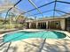 Enclosed pool area with a sun-drenched pool and beautiful patio at 3435 Black Willow Trl, Deland, FL 32724