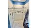 Tiled shower with two shower heads, a storage nook, and a glass door and shower curtain at 3435 Black Willow Trl, Deland, FL 32724