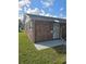 Exterior view of the brick house showcasing its charming curb appeal and well-maintained lawn on a sunny day at 36 Fairway Ct # 36, Deland, FL 32724