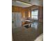 Well-lit kitchen features modern appliances, including a smooth cooktop, ample counter space, and tiled backsplash at 36 Fairway Ct # 36, Deland, FL 32724