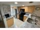 Well-equipped kitchen featuring stainless steel appliances and ample counter space at 3801 S Atlantic Ave # Ut125, New Smyrna Beach, FL 32169