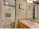 Bathroom view featuring sink, mirror, toilet, and shower at 4322 Sea Mist Dr # 4322, New Smyrna Beach, FL 32169