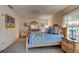 Bedroom featuring comfortable bed with blue covers, a ceiling fan, and a dresser at 4322 Sea Mist Dr # 4322, New Smyrna Beach, FL 32169