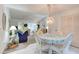 Cozy dining area with stylish chandelier and seating for four, perfect for meals at 4322 Sea Mist Dr # 4322, New Smyrna Beach, FL 32169