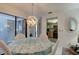 Bright dining area featuring sliding doors and a view of the kitchen at 4322 Sea Mist Dr # 4322, New Smyrna Beach, FL 32169