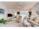 Cozy living room with plush seating, ceiling fan, and bright, airy atmosphere at 4322 Sea Mist Dr # 4322, New Smyrna Beach, FL 32169