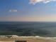 An amazing view of the Atlantic Ocean with a clear, cloud dotted blue sky at 4322 Sea Mist Dr # 4322, New Smyrna Beach, FL 32169
