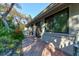 Charming patio area with brick pavers, perfect for outdoor relaxation and dining, surrounded by green foliage at 4322 Sea Mist Dr # 4322, New Smyrna Beach, FL 32169