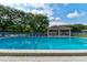 Community swimming pool with lounge chairs and a covered picnic area at 4322 Sea Mist Dr # 4322, New Smyrna Beach, FL 32169