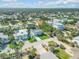 Aerial view of a neighborhood with homes, lush landscaping, and easy access to the coast at 4624 Van Kleeck Dr, New Smyrna Beach, FL 32169
